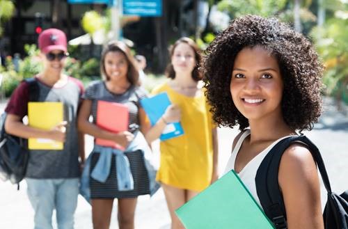 Female students smiling at camera